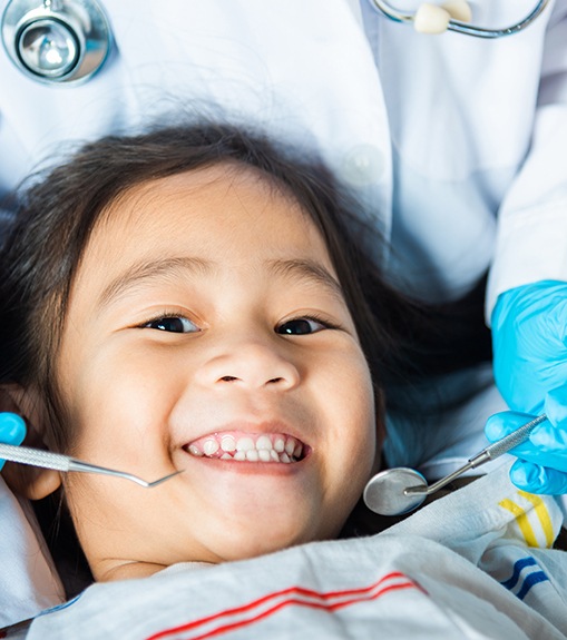 Happy child undergoing dental checkup