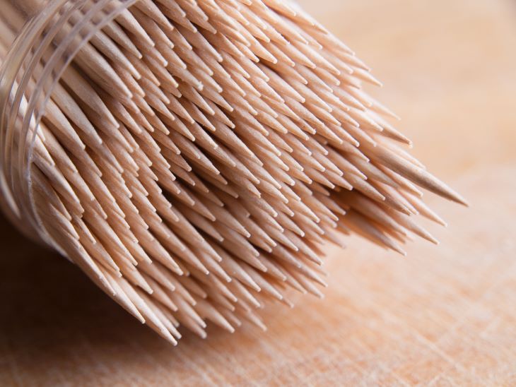 A container of wooden toothpicks.